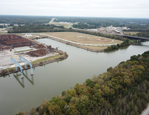A large body of water with a bridge in the middle.